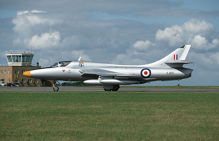 Hunter T7 XF357/G-BWGL owned by the OFMC at Duxford and painted as the T7 prototype  XJ615, taxies out to take part in the mass flypast. In 1955 the twin-seat prototype  XJ615 took to the air at the hands of Neville Duke and after a number of development and improvement stages eventually entered service as the T7 at RAF Chivenor in 1957.