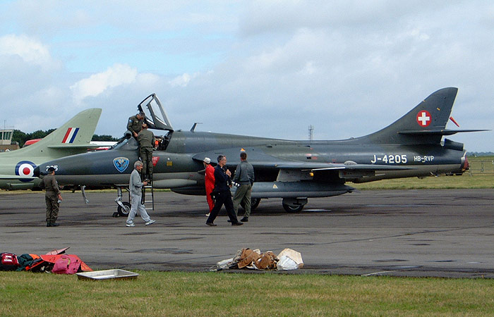 Ground crew and pilots prepare the Altenrhein Fliegermuseum's Hunter T68 J-4205/HB-RVP for an early morning practise sortie during Sunday morning.